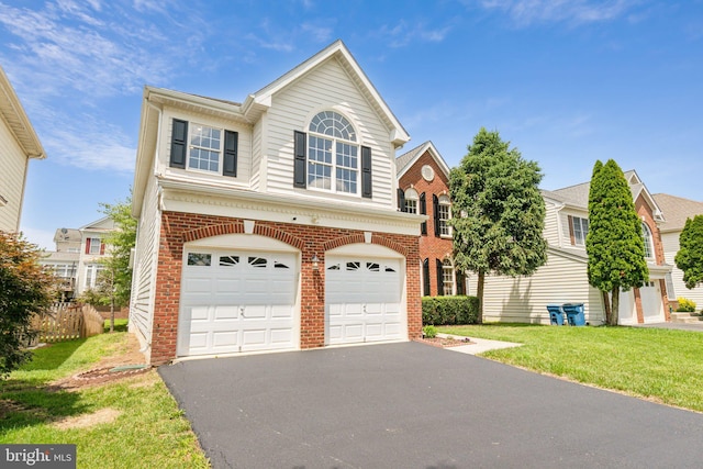 25487 Dabner Dr, Chantilly, VA 20152 - traditional-style house featuring an attached garage, brick siding, driveway, and a front lawn
