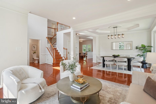 25487 Dabner Dr, Chantilly, VA 20152 - living room with wood finished floors, stairway, crown molding, and a tray ceiling