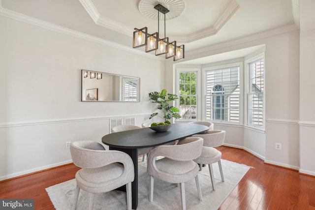 25487 Dabner Dr, Chantilly, VA 20152 - dining area with wood finished floors, a raised ceiling, crown molding, baseboards, and a chandelier