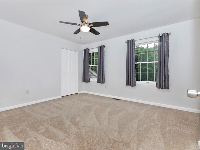 4024 Roop Rd, New Windsor, MD 21776 - spare room featuring carpet flooring, a ceiling fan, and plenty of natural light