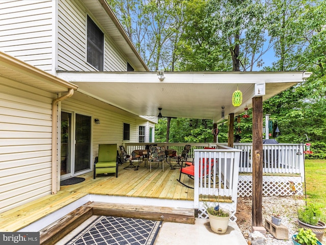 4024 Roop Rd, New Windsor, MD 21776 - deck with outdoor dining area and ceiling fan
