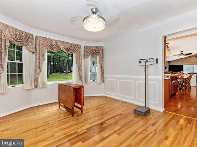 4024 Roop Rd, New Windsor, MD 21776 - spare room with ceiling fan, light wood-style flooring, and ornamental molding
