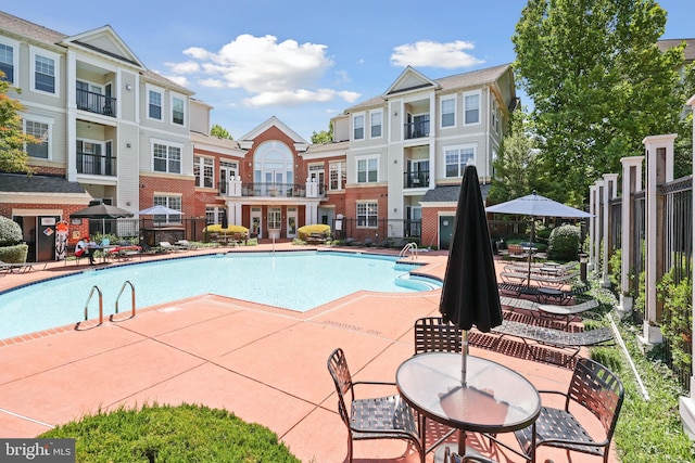 11345 Aristotle Dr Unit 6-311, Fairfax, VA 22030 - community pool featuring a patio area