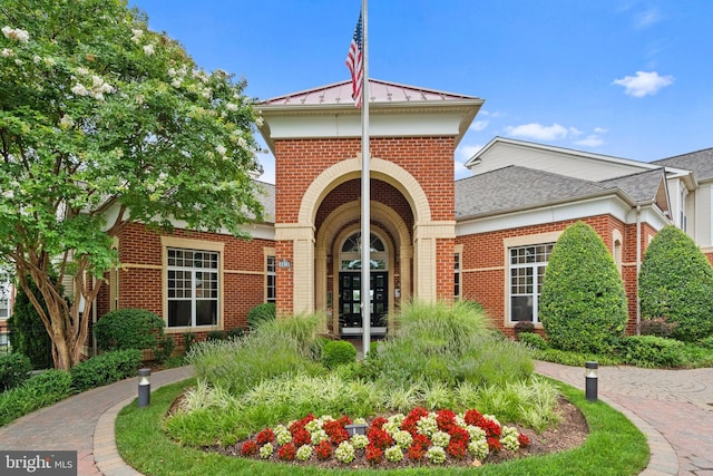 11345 Aristotle Dr Unit 6-311, Fairfax, VA 22030 - property entrance featuring brick siding, french doors, a standing seam roof, and metal roof