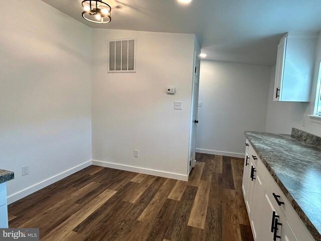 135 Crawford Quarry Rd, Falling Waters, WV 25419 - unfurnished dining area featuring dark wood-style flooring, baseboards, and recessed lighting