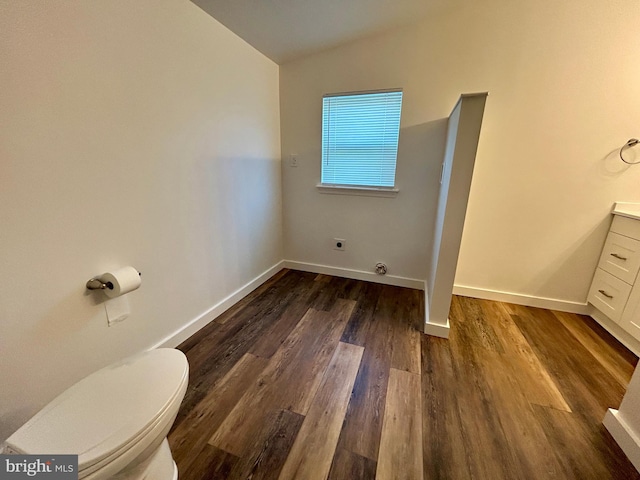 135 Crawford Quarry Rd, Falling Waters, WV 25419 - bathroom featuring vaulted ceiling, toilet, wood finished floors, vanity, and baseboards