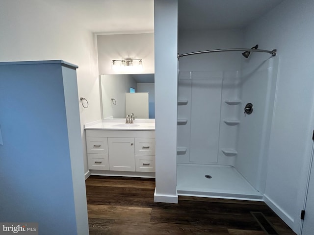 135 Crawford Quarry Rd, Falling Waters, WV 25419 - full bathroom featuring wood finished floors, vanity, and a shower