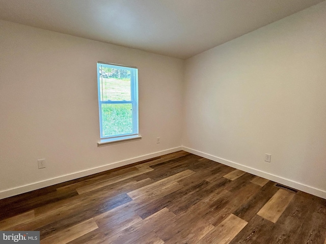 135 Crawford Quarry Rd, Falling Waters, WV 25419 - spare room featuring baseboards and dark wood-type flooring