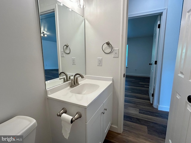 135 Crawford Quarry Rd, Falling Waters, WV 25419 - bathroom with wood finished floors, vanity, toilet, and baseboards