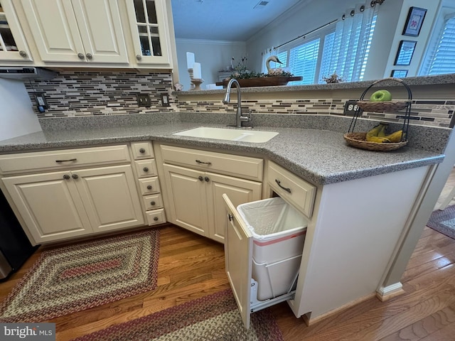 4503-J Dunton Ter, Perry Hall, MD 21128 - kitchen with a sink, crown molding, backsplash, dark wood finished floors, and white cabinets