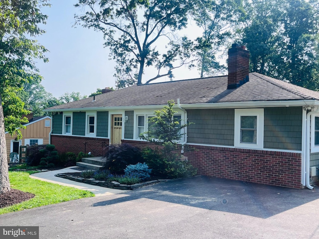 8005 Crest Rd, Laurel, MD 20723 - ranch-style home featuring brick siding, a chimney, and a shingled roof