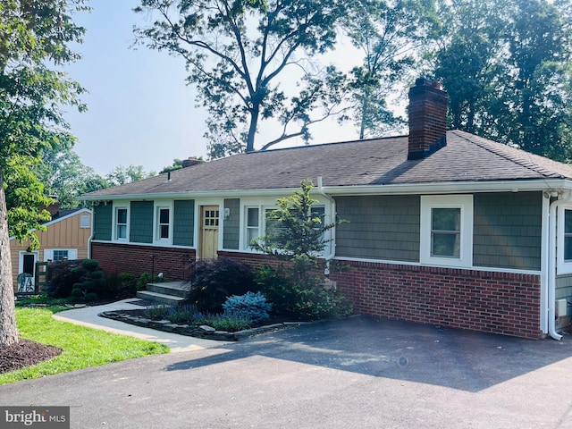 8005 Crest Rd, Laurel, MD 20723 - ranch-style home featuring brick siding, a chimney, and a shingled roof