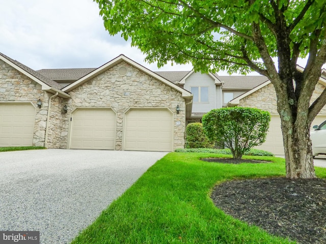 2543 Fairway Dr Unit 2543, York, PA 17402 - view of front of property featuring stone siding, an attached garage, driveway, and a front yard