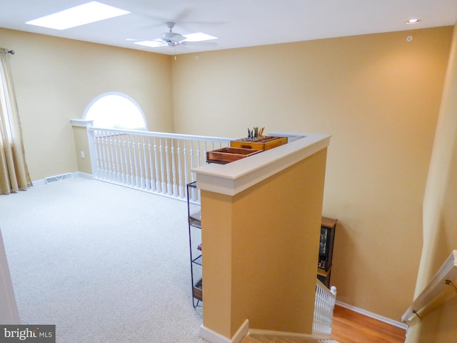2543 Fairway Dr Unit 2543, York, PA 17402 - hallway with an upstairs landing, a skylight, and carpet flooring