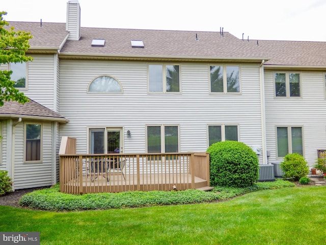 2543 Fairway Dr Unit 2543, York, PA 17402 - back of property with a deck, a yard, a chimney, and a shingled roof