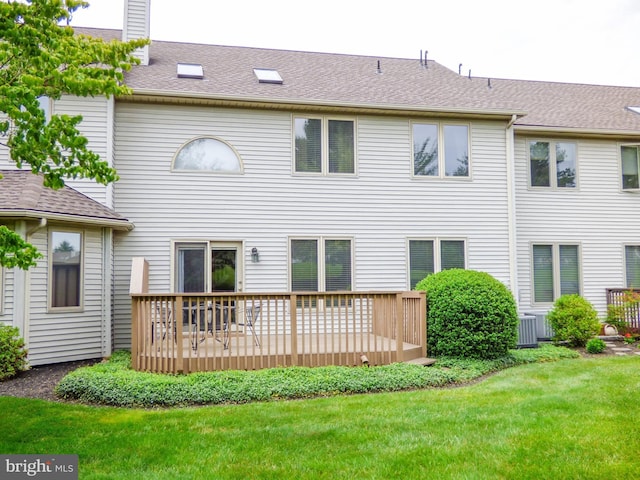 2543 Fairway Dr Unit 2543, York, PA 17402 - back of property featuring a wooden deck, a lawn, and roof with shingles