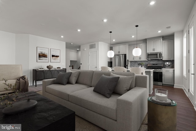 43294 Farringdon Sq, Broadlands, VA 20148 - living room with dark wood-style flooring, recessed lighting, and baseboards