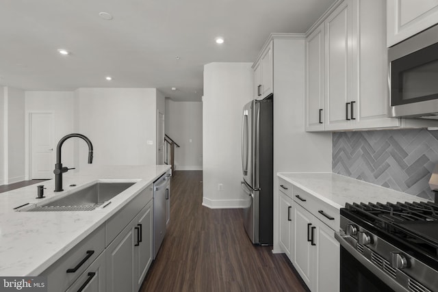 43294 Farringdon Sq, Broadlands, VA 20148 - kitchen featuring stainless steel appliances, a sink, dark wood-style flooring, light stone countertops, and decorative backsplash
