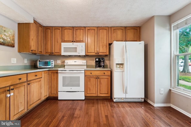 9175 Forest Lawn Ct, Springfield, VA 22152 - kitchen featuring white appliances, brown cabinetry, dark wood-style floors, light countertops, and baseboards