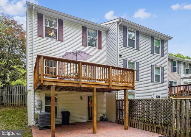 9175 Forest Lawn Ct, Springfield, VA 22152 - back of house with central air condition unit and a wooden deck