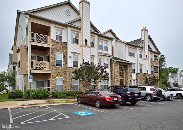 5909 Founders Hill Dr Unit 101, Alexandria, VA 22310 - view of building exterior featuring uncovered parking