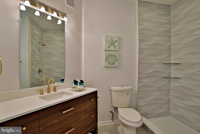 5909 Founders Hill Dr Unit 101, Alexandria, VA 22310 - full bath featuring vanity, a tile shower, toilet, and tile patterned flooring