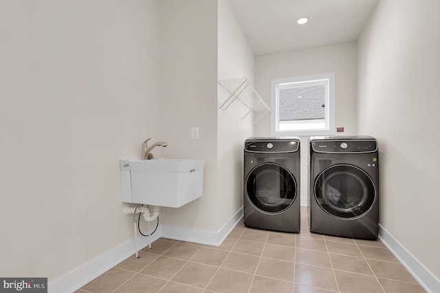 14009 Kip Ter, North Potomac, MD 20878 - laundry area with independent washer and dryer, baseboards, and light tile patterned floors