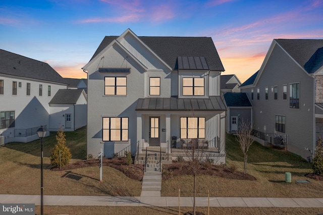 14009 Kip Ter, North Potomac, MD 20878 - view of front of house with a standing seam roof, a porch, metal roof, cooling unit, and board and batten siding