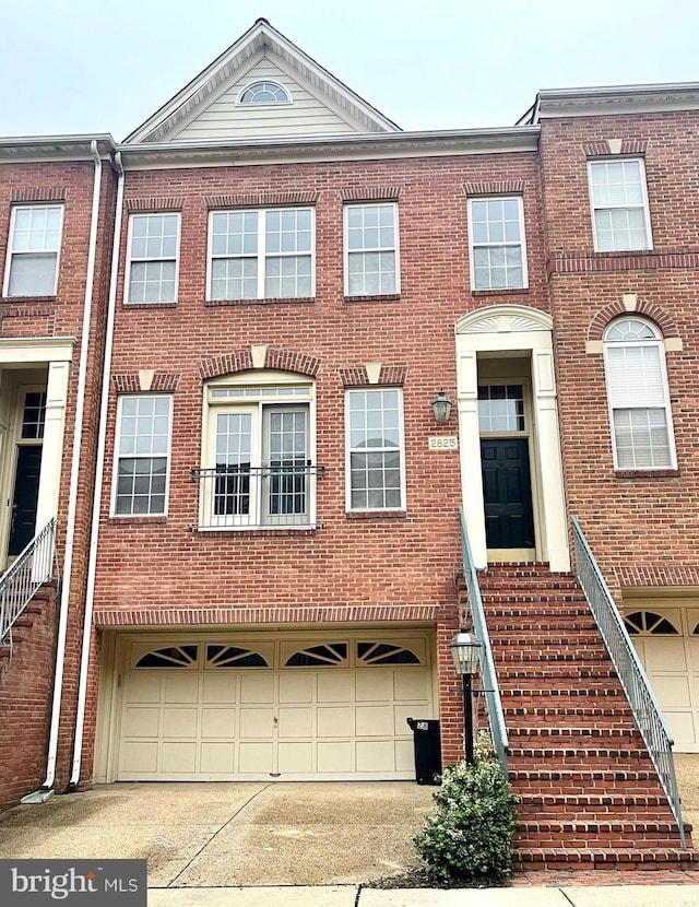 2825 Laura Gae Cir, Vienna, VA 22180 - multi unit property featuring a garage, concrete driveway, and brick siding