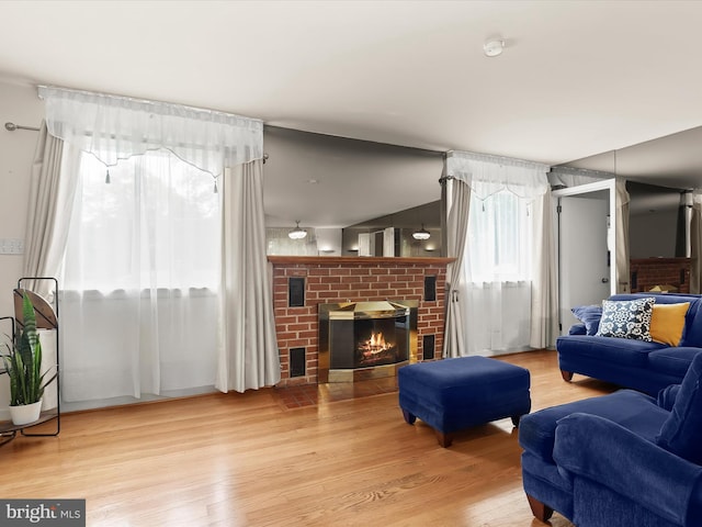 3807 24th Ave, Temple Hills, MD 20748 - living room with a brick fireplace and wood finished floors