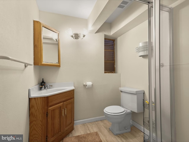 3807 24th Ave, Temple Hills, MD 20748 - bathroom featuring vanity, toilet, wood finished floors, and baseboards