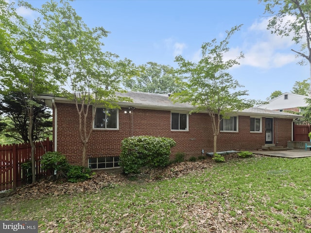 3807 24th Ave, Temple Hills, MD 20748 - view of home's exterior with brick siding, a patio area, and entry steps