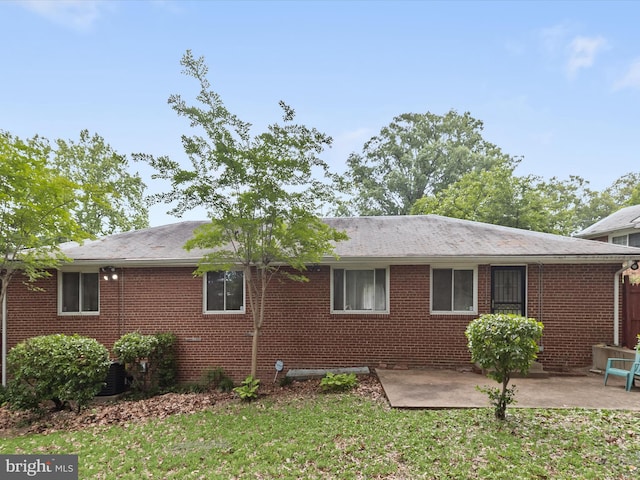 3807 24th Ave, Temple Hills, MD 20748 - view of side of property featuring a patio area, brick siding, and a yard