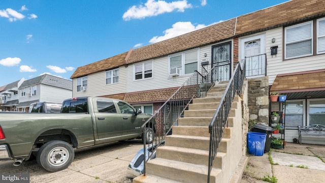 3119 Comly Rd, Philadelphia, PA 19154 - townhome / multi-family property featuring a shingled roof, a residential view, and cooling unit