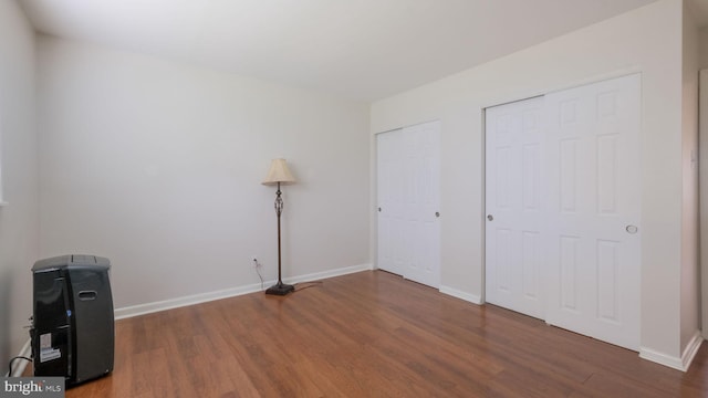 3119 Comly Rd, Philadelphia, PA 19154 - unfurnished bedroom with wood finished floors, multiple closets, and baseboards