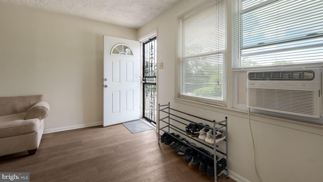 3119 Comly Rd, Philadelphia, PA 19154 - entryway with wood finished floors, a textured ceiling, baseboards, and cooling unit