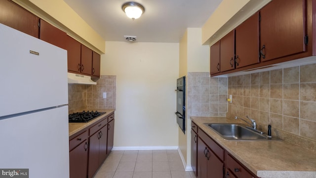 3119 Comly Rd, Philadelphia, PA 19154 - kitchen with black appliances, a sink, under cabinet range hood, decorative backsplash, and light tile patterned floors