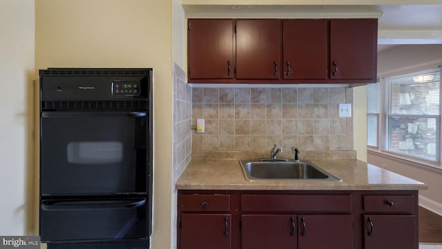 3119 Comly Rd, Philadelphia, PA 19154 - kitchen with a sink, a warming drawer, decorative backsplash, light countertops, and baseboards