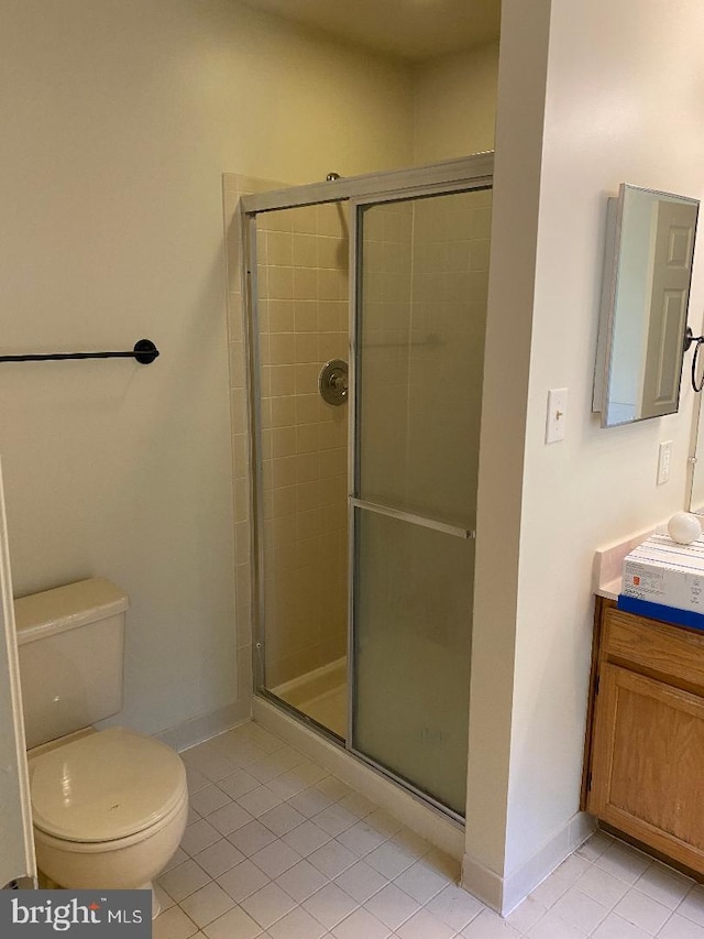 3299 Corcyra Ct, Woodbridge, VA 22192 - bathroom with tile patterned floors, toilet, vanity, and a stall shower