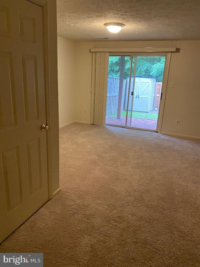 3299 Corcyra Ct, Woodbridge, VA 22192 - carpeted empty room with a textured ceiling and baseboards