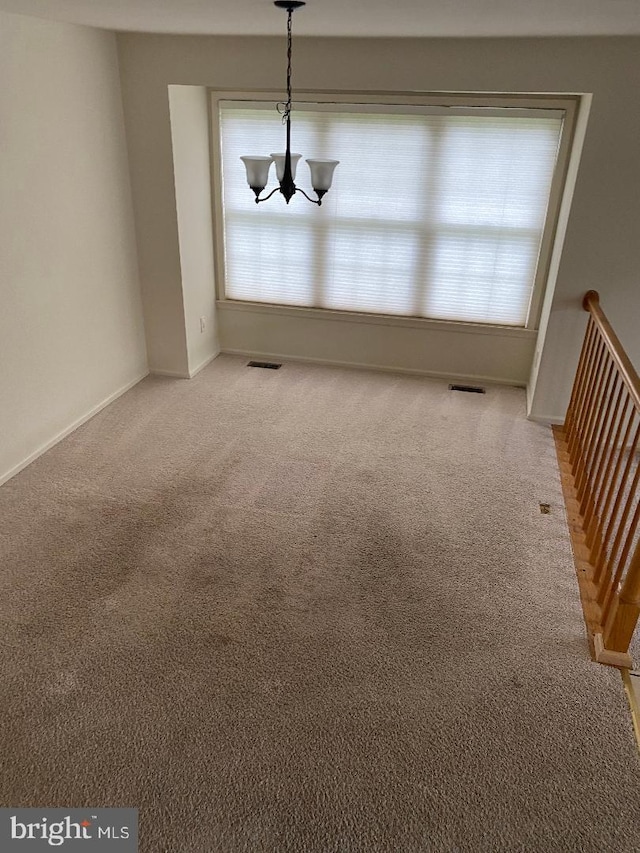 3299 Corcyra Ct, Woodbridge, VA 22192 - empty room featuring carpet floors, healthy amount of natural light, and a chandelier