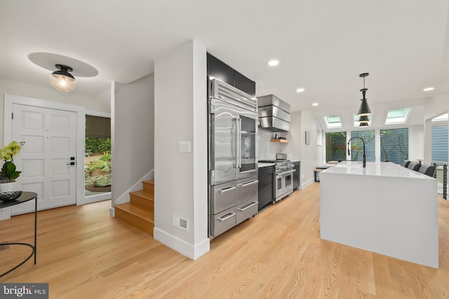 2201 Burgee Ct, Reston, VA 20191 - kitchen with high end appliances, baseboards, light countertops, open shelves, and light wood-style flooring