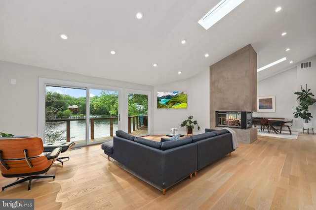 2201 Burgee Ct, Reston, VA 20191 - living area featuring a multi sided fireplace, light wood-type flooring, recessed lighting, a water view, and baseboards