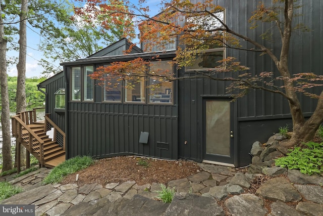 2201 Burgee Ct, Reston, VA 20191 - view of side of property with stairway, board and batten siding, and a deck