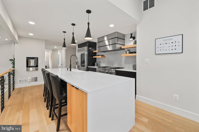 2201 Burgee Ct, Reston, VA 20191 - kitchen with wall chimney exhaust hood, open shelves, baseboards, light wood finished floors, and backsplash