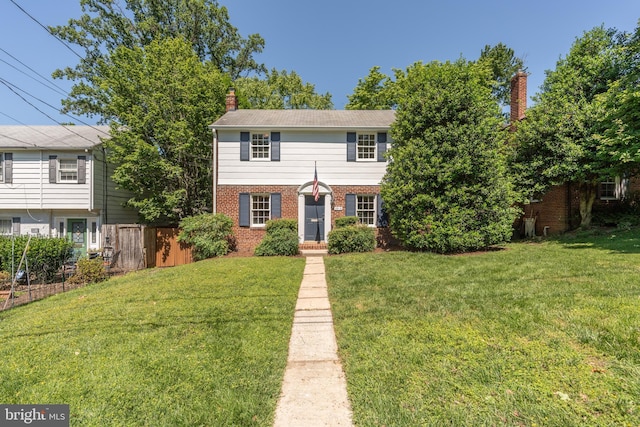 5312 Baltimore Ave, Chevy Chase, MD 20815 - view of front of house featuring brick siding and a chimney