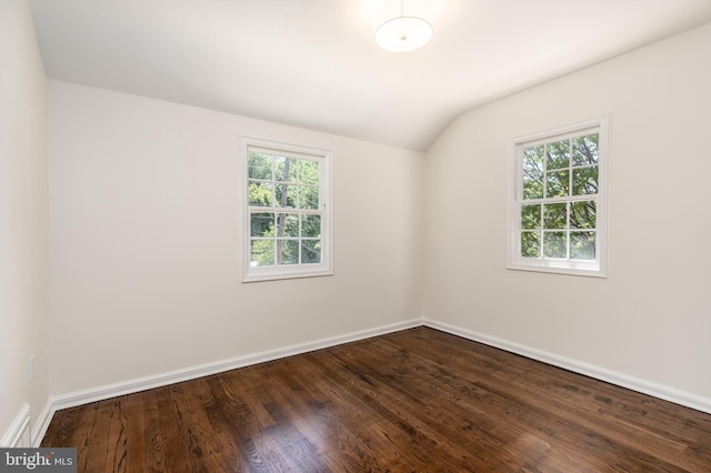 5312 Baltimore Ave, Chevy Chase, MD 20815 - unfurnished room with healthy amount of natural light, vaulted ceiling, dark wood-style floors, and baseboards