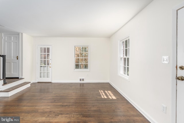 5312 Baltimore Ave, Chevy Chase, MD 20815 - unfurnished living room featuring dark wood-type flooring and baseboards