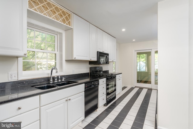 5312 Baltimore Ave, Chevy Chase, MD 20815 - kitchen featuring a sink, black appliances, dark countertops, white cabinets, and recessed lighting