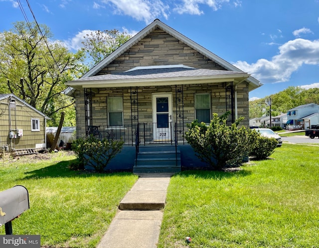202 E Charleston, Lawnside, NJ 08045 - view of front facade with stone siding, covered porch, and a front yard